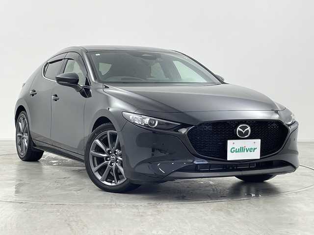 マツダ マツダ３ファストバック 15S ツーリング 群馬県 2023(令5)年 1.6万km ジェットブラックマイカ 純正１０．２５型ナビ　全周囲カメラ　衝突被害軽減ブレーキ　ブラインドスポットモニター　アダプティブクルーズコントロール　前後ドライブレコーダー　ETC 置くだけ充電器　LED オートハイビーム　禁煙車