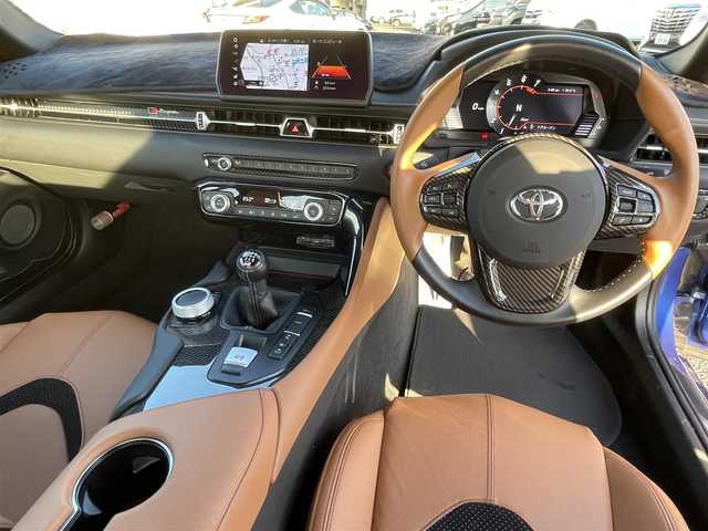 トヨタ スープラ RZ 広島県 2023(令5)年 1.3万km 青 RACECHIP（+73ps・+85Nm）/本革シート（タンカラー）/・シートヒーター/・パワーシート/革巻きステアリング（タンカラー×ブラック）/レッドキャリパー/純正ナビ（AM/FM/フルセグTV/Bluetooth）/バックカメラ/ETC/前後ドラレコ（デジタルインナーミラー一体型）/JBLプレミアムサウンド/レーダークルーズコントロール/衝突被害軽減ブレーキ/車線逸脱警報/ブラインドスポットモニター/コーナーセンサー/カラーヘッドアップディスプレイ