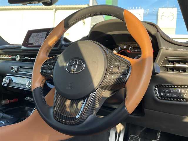 トヨタ スープラ RZ 広島県 2023(令5)年 1.3万km 青 RACECHIP（+73ps・+85Nm）/本革シート（タンカラー）/・シートヒーター/・パワーシート/革巻きステアリング（タンカラー×ブラック）/レッドキャリパー/純正ナビ（AM/FM/フルセグTV/Bluetooth）/バックカメラ/ETC/前後ドラレコ（デジタルインナーミラー一体型）/JBLプレミアムサウンド/レーダークルーズコントロール/衝突被害軽減ブレーキ/車線逸脱警報/ブラインドスポットモニター/コーナーセンサー/カラーヘッドアップディスプレイ