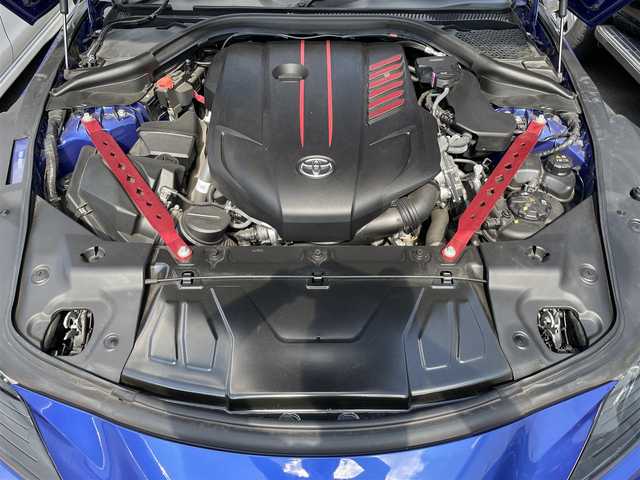 トヨタ スープラ RZ 広島県 2023(令5)年 1.3万km 青 RACECHIP（+73ps・+85Nm）/本革シート（タンカラー）/・シートヒーター/・パワーシート/革巻きステアリング（タンカラー×ブラック）/レッドキャリパー/純正ナビ（AM/FM/フルセグTV/Bluetooth）/バックカメラ/ETC/前後ドラレコ（デジタルインナーミラー一体型）/JBLプレミアムサウンド/レーダークルーズコントロール/衝突被害軽減ブレーキ/車線逸脱警報/ブラインドスポットモニター/コーナーセンサー/カラーヘッドアップディスプレイ