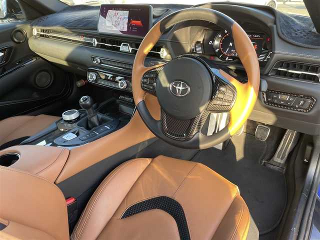 トヨタ スープラ RZ 広島県 2023(令5)年 1.3万km 青 RACECHIP（+73ps・+85Nm）/本革シート（タンカラー）/・シートヒーター/・パワーシート/革巻きステアリング（タンカラー×ブラック）/レッドキャリパー/純正ナビ（AM/FM/フルセグTV/Bluetooth）/バックカメラ/ETC/前後ドラレコ（デジタルインナーミラー一体型）/JBLプレミアムサウンド/レーダークルーズコントロール/衝突被害軽減ブレーキ/車線逸脱警報/ブラインドスポットモニター/コーナーセンサー/カラーヘッドアップディスプレイ