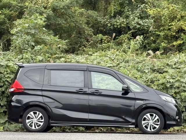 ホンダ フリード ハイブリット EX 大分県 2017(平29)年 11.8万km クリスタルブラックパール ホンダセンシング /両側パワースライドドア/モデューロエアロパーツ/純正メモリーナビ/バックカメラ/フルセグ/DVD/Bluetooth/ハーフレザーシート/シートヒーター/アダプティブクルーズコントロール/レーンキープアシスト/ビルトインETC/純正LEDヘッドライト/オートライトコントロール/スマートキー/エンジンプッシュスタート/純正15インチアルミホイール