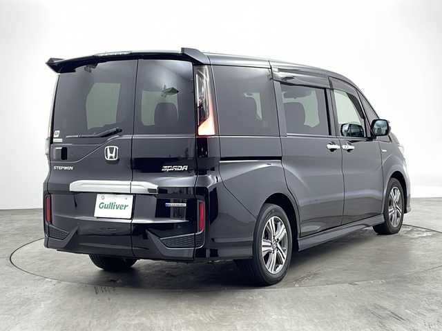 ホンダ ステップワゴン スパーダ ハイブリッド G ホンダセンシング 兵庫県 2018(平30)年 5.3万km プレミアムスパークルブラックパール ・純正9型ナビ＆フルセグ＆BT＆DVD/・バックカメラ/・両側パワースライドドア/・Honda SENSING/・衝突軽減ブレーキ/・レーンキープアシスト/・レーダークルーズコントロール/・路外逸脱抑制機能/・誤発進抑制機能/・渋滞追従機能付/・LKAS〈車線維持支援システム〉/・先行車発進お知らせ機能/・標識認識機能/・スマートキー/・プッシュスタート/・ビルトインETC/・純正フロアマット/・純正16インチアルミホイール/・LEDヘッドライト/・フォグ/・オートライト/・ステアリングスイッチ/・ドアバイザー