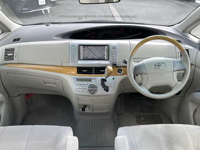 トヨタ エスティマ アエラス Gエディション 富山県 2007(平19)年 7万km ブラック スマートキー/３列シート/両側パワースライドドア/純正HDDナビ(NH3T-W56)/純正フリップダウンモニター(V9T-R56C)/バックカメラ/DVD/CD/MD/ビルトインETC/HIDヘッドライト/フォグランプ/純正フロアマット/電格ウィンカーミラー/木目・革巻きステアリング/プッシュスタート/TVキャンセラー/純正１７インチAW/保証書・取説