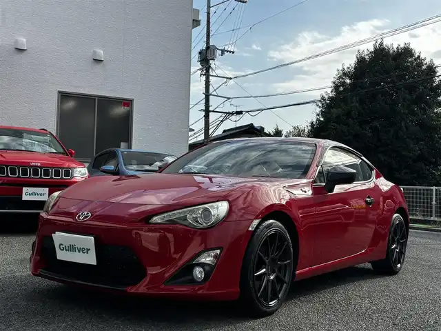 トヨタ ８６ GT リミテッド 熊本県 2012(平24)年 9.1万km ライトニングレッド HKSマフラー/POTENZA17インチAW/純正SDナビ（NSZT-W62G）/【フルセグTV/CD/DVD/SD/BT】/バックカメラ/パドルシフト/ハーフレザーシート/D/Nシートヒーター/HIDオートライト/純正フロアマット/プッシュスタート/スマートキー/スペアキー/取扱説明書(車両/ナビ)