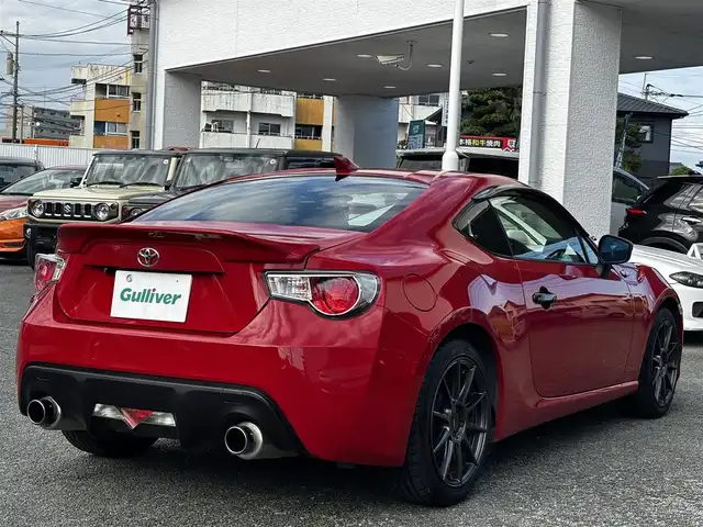 トヨタ ８６ GT リミテッド 熊本県 2012(平24)年 9.1万km ライトニングレッド HKSマフラー/POTENZA17インチAW/純正SDナビ（NSZT-W62G）/【フルセグTV/CD/DVD/SD/BT】/バックカメラ/パドルシフト/ハーフレザーシート/D/Nシートヒーター/HIDオートライト/純正フロアマット/プッシュスタート/スマートキー/スペアキー/取扱説明書(車両/ナビ)