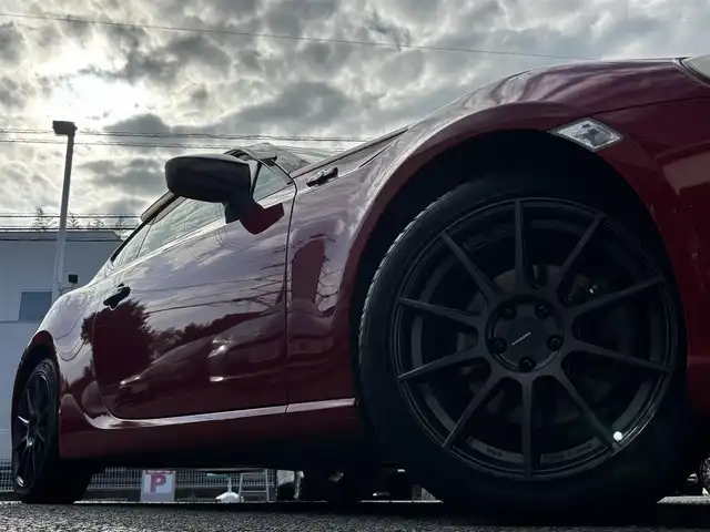 トヨタ ８６ GT リミテッド 熊本県 2012(平24)年 9.1万km ライトニングレッド HKSマフラー/POTENZA17インチAW/純正SDナビ（NSZT-W62G）/【フルセグTV/CD/DVD/SD/BT】/バックカメラ/パドルシフト/ハーフレザーシート/D/Nシートヒーター/HIDオートライト/純正フロアマット/プッシュスタート/スマートキー/スペアキー/取扱説明書(車両/ナビ)