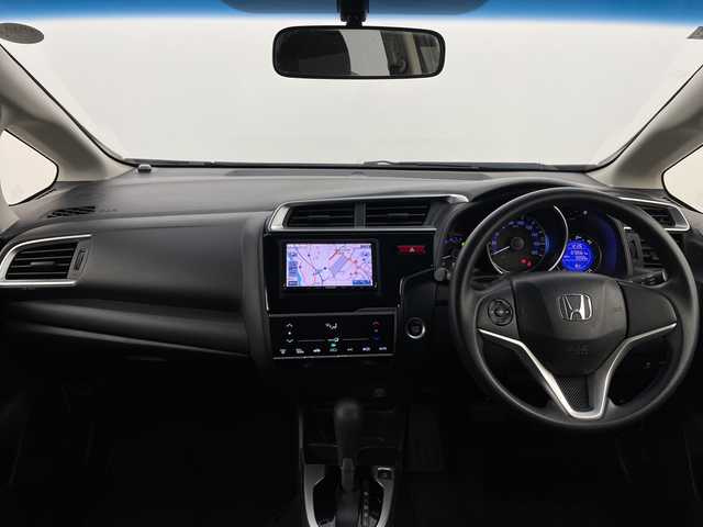 ホンダ フィット 13G Fパッケージ 新潟県 2015(平27)年 7.1万km ブリリアントスポーティブルーメタリック2トーン 4WD/スマートキー/メモリナビ　型式MDV-L402/CD/DVD/SD/ワンセグ/バックカメラ/バイザー/フロアマット/スタッドレスタイヤ4本セット/取扱説明書