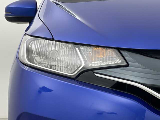 ホンダ フィット 13G Fパッケージ 新潟県 2015(平27)年 7.1万km ブリリアントスポーティブルーメタリック2トーン 4WD/スマートキー/メモリナビ　型式MDV-L402/CD/DVD/SD/ワンセグ/バックカメラ/バイザー/フロアマット/スタッドレスタイヤ4本セット/取扱説明書