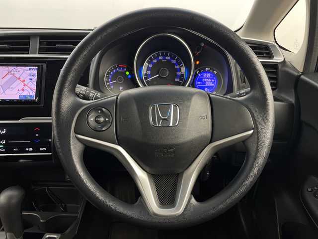 ホンダ フィット 13G Fパッケージ 新潟県 2015(平27)年 7.1万km ブリリアントスポーティブルーメタリック2トーン 4WD/スマートキー/メモリナビ　型式MDV-L402/CD/DVD/SD/ワンセグ/バックカメラ/バイザー/フロアマット/スタッドレスタイヤ4本セット/取扱説明書