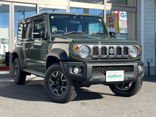 スズキ ジムニー ノマド FC 青森県 2025(令7)年 0.1千km ＤグリーンＭ ワンオーナー/令和7年10月登録/登録時総走行距離33キロ/クルーズコントロール、追従走行あり/アイドリングストップ/D/N席シートヒーター/パーキングアシスト/背面タイヤ/衝突被害軽減システム/コーナーセンサー/横滑り防止装置/レーンアシスト/純正LEDヘッドライト/フォグランプ/スペアキー/取扱説明書/保証書