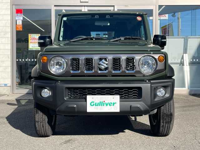 スズキ ジムニー ノマド FC 青森県 2025(令7)年 0.1千km ＤグリーンＭ ワンオーナー/令和7年10月登録/登録時総走行距離33キロ/クルーズコントロール、追従走行あり/アイドリングストップ/D/N席シートヒーター/パーキングアシスト/背面タイヤ/衝突被害軽減システム/コーナーセンサー/横滑り防止装置/レーンアシスト/純正LEDヘッドライト/フォグランプ/スペアキー/取扱説明書/保証書