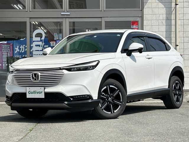 ホンダ ヴェゼル G 岩手県 2023(令5)年 2.1万km プラチナホワイトパール ・4WD/・寒冷地仕様/・社外ナビ（VXM-235ci）/・CD/AM/FM/SD/USB/Bluetooth/・バックカメラ/・プッシュスタート/・スマートキー/・ホンダセンシング/・アイドリングストップ/・ダウンヒルアシストコントロール/・電子制御パーキングブレーキ/・クルーズコントロール（追従有）/・シートヒーター（D＋N）/・LEDヘットライト/・ライトレベライザ/・純正AW16インチ/・純正フロアマット/・ドアバイザー/・スタットレスタイヤAWセット車載/・保証書/・取扱説明書