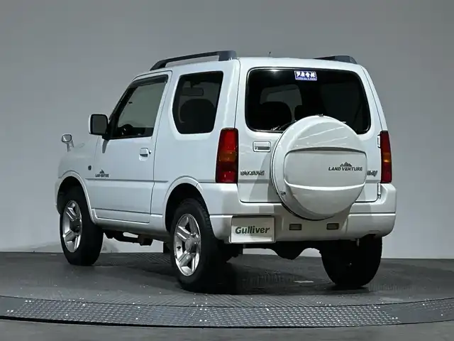 スズキ ジムニー ランドベンチャー 愛媛県 2005(平17)年 17.4万km パールホワイトマイカ 社外HDDナビ（CDDVDワンセグ）純正アルミホイール　純正フロアマット　ルーフレール　シートヒーター　背面タイヤ　ETC　ハーフレーザー　リモコンキー　スペアキー　ABS　キセノンヘットライト