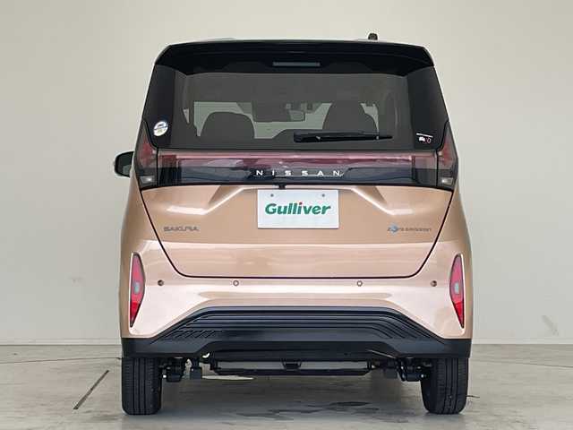日産 サクラ X 90周年記念車 愛知県 2024(令6)年 0.4万km オレンジ 純正9型ナビ/全方位カメラ/コーナーセンサー/純正アルミホイール/バックカメラ/オートマチックハイビーム/ドライブレコーダー/ＥＴＣ/衝突軽減システム/フルセグ/CD DVD/Bluetooth/ステアリングスイッチ/スマートキー/プッシュスタート