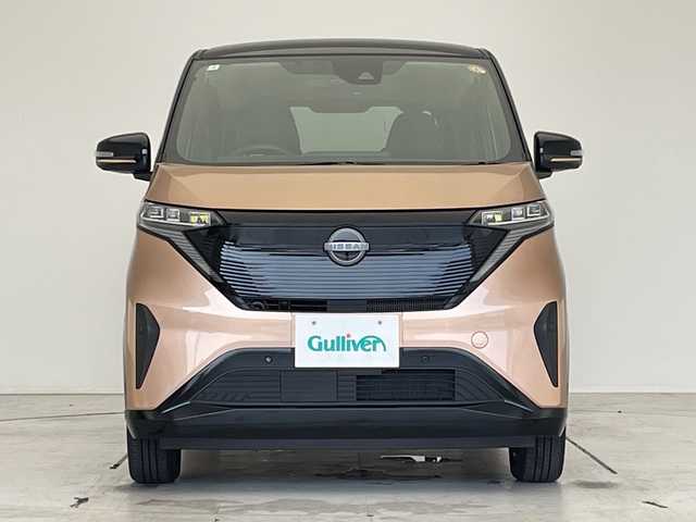 日産 サクラ X 90周年記念車 愛知県 2024(令6)年 0.4万km オレンジ 純正9型ナビ/全方位カメラ/コーナーセンサー/純正アルミホイール/バックカメラ/オートマチックハイビーム/ドライブレコーダー/ＥＴＣ/衝突軽減システム/フルセグ/CD DVD/Bluetooth/ステアリングスイッチ/スマートキー/プッシュスタート