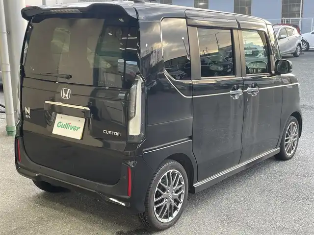 ホンダ Ｎ ＢＯＸ カスタム ターボ 愛知県 2023(令5)年 0.2万km クリスタルブラックパール 登録時走行距離1271km/ワンオーナー/純正9インチSDナビ/(Bluetooth/フルセグTV/DVD)/バックカメラ/コーナーセンサー/ホンダセンシング/衝突軽減ブレーキ/誤発信抑制機能/路外逸脱抑制機能/歩行者事故低減ステアリング/先行車発進告知/標識認識機能/オートハイビーム/レーンキーピングアシスト/アダプティブクルーズコントロール/両側パワスラ/ステアリングスイッチ/ハーフレザーシート/前席シートヒーター/パドルシフト/ヘッドランプレベライザー/マルチインフォメーションディスプレイ/左側アンダーミラー/純正ドアバイザー/純正フロアマット/プッシュスタート/スマートキー/取説/保証書