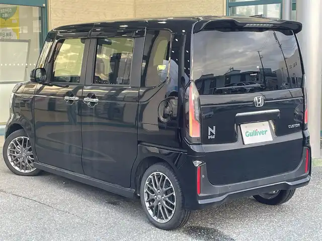 ホンダ Ｎ ＢＯＸ カスタム ターボ 愛知県 2023(令5)年 0.2万km クリスタルブラックパール 登録時走行距離1271km/ワンオーナー/純正9インチSDナビ/(Bluetooth/フルセグTV/DVD)/バックカメラ/コーナーセンサー/ホンダセンシング/衝突軽減ブレーキ/誤発信抑制機能/路外逸脱抑制機能/歩行者事故低減ステアリング/先行車発進告知/標識認識機能/オートハイビーム/レーンキーピングアシスト/アダプティブクルーズコントロール/両側パワスラ/ステアリングスイッチ/ハーフレザーシート/前席シートヒーター/パドルシフト/ヘッドランプレベライザー/マルチインフォメーションディスプレイ/左側アンダーミラー/純正ドアバイザー/純正フロアマット/プッシュスタート/スマートキー/取説/保証書