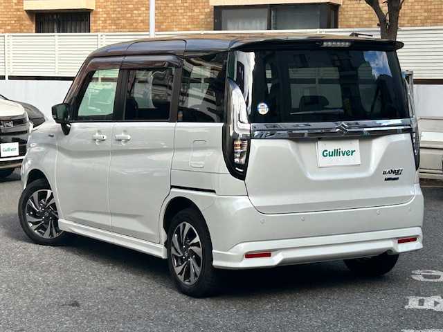 スズキ ソリオ バンディット HV MV 東京都 2023(令5)年 0.3万km ピュアホワイトパール/ガンメタリック2トーン ワンオーナー/純正ナビ(フルセグTV、CD、DVD、Bluetooth)/全席ヒートシーター/全方位カメラ/両側パワースライド/アダプティブクルーズコントロール/デュアルカメラブレーキサポート/前後誤発進抑制機能/後退時ブレーキサポート/オートハイビーム/前後ドライブレコーダー/スペアキー/アイドリングストップ/横滑り防止/取扱説明書/保証書/記録簿