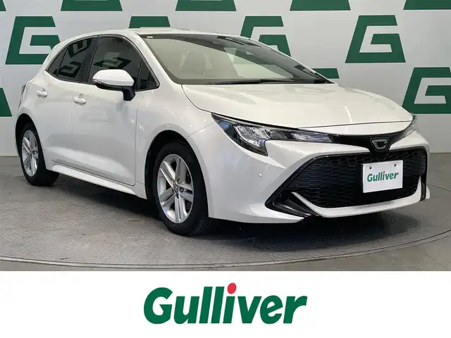 トヨタ カローラ スポーツ G 鹿児島県 2019(平31)年 9.1万km ホワイトパールクリスタルシャイン 禁煙車　/トヨタセーフティセンス/ナビ(CD/DVD/フルセグTV/Bluetooth)　/バックカメラ　/パドルシフト　/ＥＴＣ　/コーナーセンサー　/追従型クルーズコントロール/純正アルミホイール/純正フロアマット　/電動パーキングブレーキ/オートブレーキホールド　/オートマチックハイビーム　/トノカバー/スマートキー/プッシュスタート