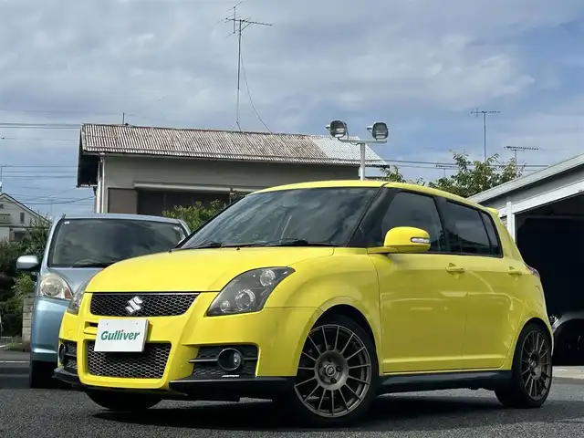 スズキ スイフト スポーツ 東京都 2010(平22)年 12.1万km チャンピオンイエロー 社外メモリグナビ（AVIC-RZ901）/・ワンセグTV/Bluetooth/iPod/AUX/USB/ENKEI製17インチアルミホイール/Monster　Sport製フロアマット/Monster　Sport製エアインダクションボックス/SUZUKI　SPORTS製エアクリーナー/TEIN製車高調整キット/HKS製マフラー/ETC/オートライト/カーテンエアバック/スマートキー/保証書/取説書