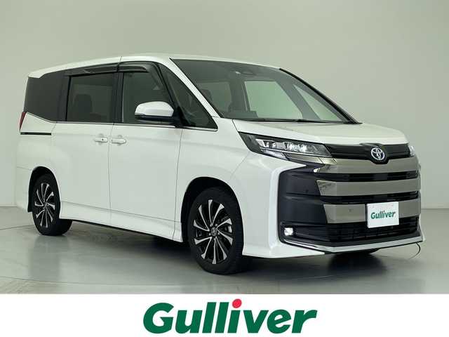 トヨタ ノア ハイブリッド S－Z 愛知県 2022(令4)年 4.1万km ホワイトパールクリスタルシャイン 禁煙車/ワンオーナー/純正10.5インチディスプレイオーディオ（コネクティッドナビ対応）/快適パッケージhigh/バックカメラ/両側パワースライドドア/レーダークルーズコントロール/全席シータヒーター/ステアリングヒーター/トヨタセーフティセンス/プリクラッシュセーフティ〔PCS〕/レーントレーシングアシスト〔LTA〕/アダプティブハイビームシステム〔AHS〕/ブラインドスポットモニター〔BSM〕/クリアランスソナー/ハーフレザーシート/オットマン/LEDヘッドライト/オートハイビーム/純正17AW/純正フロアマット/プッシュスタート/スマートキー/スペアキー