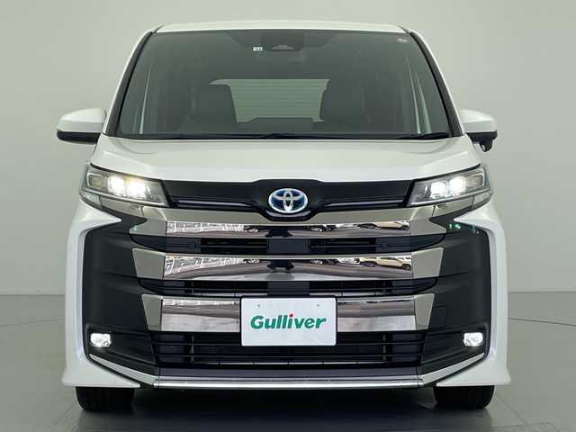 トヨタ ノア ハイブリッド S－Z 愛知県 2022(令4)年 4.1万km ホワイトパールクリスタルシャイン 禁煙車/ワンオーナー/純正10.5インチディスプレイオーディオ（コネクティッドナビ対応）/快適パッケージhigh/バックカメラ/両側パワースライドドア/レーダークルーズコントロール/全席シータヒーター/ステアリングヒーター/トヨタセーフティセンス/プリクラッシュセーフティ〔PCS〕/レーントレーシングアシスト〔LTA〕/アダプティブハイビームシステム〔AHS〕/ブラインドスポットモニター〔BSM〕/クリアランスソナー/ハーフレザーシート/オットマン/LEDヘッドライト/オートハイビーム/純正17AW/純正フロアマット/プッシュスタート/スマートキー/スペアキー