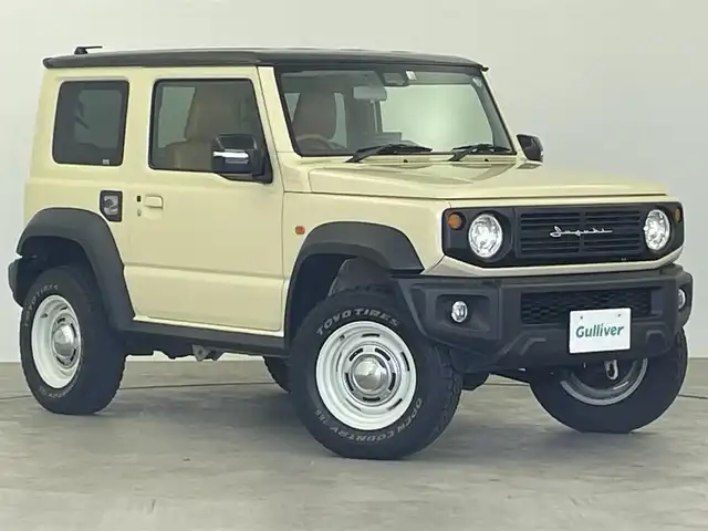 スズキ ジムニー シエラ JC 大分県 2022(令4)年 2.9万km シフォンアイボリーメタリックブラック2トーンルーフ 社外ディスプレイオーディオ/・Bluetooth・AM・FM・iPod/バックカメラ/4WD/衝突軽減ブレーキ/車線逸脱防止システム/アイドリングストップ/ヘッドライトウォッシャー/横滑り防止装置/セルディセントコントロール/ETC/本革巻きステアリング/前席シートヒーター/DEAＮ製16インチＡＷ/ＬＥＤヘッドライト/フォグランプ/シートカバー/ステアリングリモコン/プッシュスタート/スマートキー/オートライト/純正フロアマット