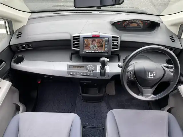 ホンダ フリード FLEXエアロ 三重県 2009(平21)年 11万km プレミアムホワイトパール 登録時109677km/ワンオーナー/禁煙車/純正ナビ/（AM/FM/TV）/ワンセグTV/バックカメラ/ETC/ステアリングスイッチ/オートライト/片側パワスラ/純正フロアマット/純正アルミ
