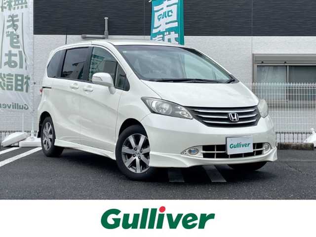 ホンダ フリード FLEXエアロ 三重県 2009(平21)年 11万km プレミアムホワイトパール 登録時109677km/ワンオーナー/禁煙車/純正ナビ/（AM/FM/TV）/ワンセグTV/バックカメラ/ETC/ステアリングスイッチ/オートライト/片側パワスラ/純正フロアマット/純正アルミ