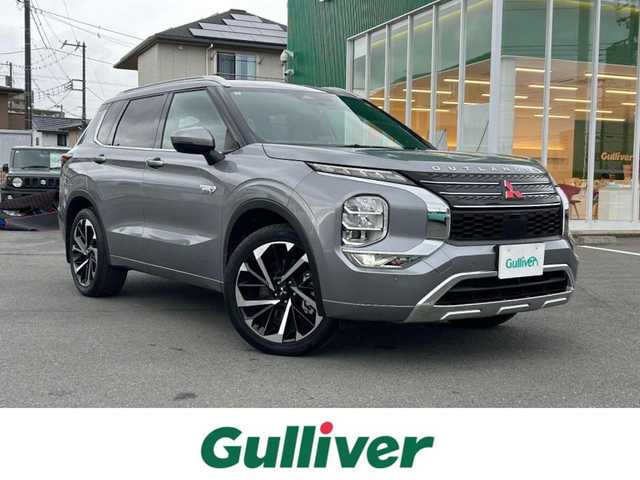 三菱 アウトランダー ＰＨＥＶ P 静岡県 2022(令4)年 2.3万km チタニウムグレーメタリック エンジンスタートボタン/パワーステアリング/パワーウィンドウ/プラグインハイブリッド/4WD/アイドリングストップ/スマートキー/Wオートエアコン/クルーズコントロール/ETC2.0/USB入力端子/全方位カメラ/純正ナビ（BT.フルセグ）/サンルーフ/電動リアゲート/ドライブレコーダー前後/D席N席パワーシート/全席シートヒーター/純正フロアマット/純正アルミホイール/ルーフレール/ABS/横滑り防止装置/コーナーセンサー前後/オートライト/オートマチックハイビーム/LEDライト/W+サイドエアバック/衝突軽減システム/BOSEスピーカー/デジタルインナーミラー/社外アルミホイール車内有（スタッドレス）