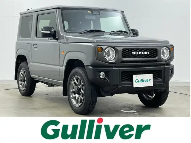 スズキ ジムニー XC 岡山県 2023(令5)年 2.1万km ミディアムグレー ８インチナビ　(SGC-812）/【CD/DVD/BT/フルセグ】/ターボ/シートヒーター　/ＬＥＤヘッドライト　/ＥＴＣ　/バックカメラ　/クルーズコントロール　/オートハイビーム　/ダウンヒルアシスト　/スマートキー/フォグランプ/純正アルミ/純正フロアマット/アイドリングストップ