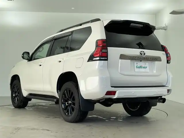 トヨタ ランドクルーザー プラド TX-L 70thアニバーサリーLTD 福井県 2022(令4)年 1.9万km ホワイトパールクリスタルシャイン 純正メーカーオプション９インチナビ/７人乗り仕様/寒冷地仕様　/全方位モニター　/プラドスーパーライブサウンド　　/サドルタン快適温熱レザーシート/純正１８インチアルミホイール　/純正スターター　/純正ビルトインＥＴＣ２．０/純正LEDヘッドライト/純正LEDフロントフォグ/フロントシールドデアイサー/ブラックルーフレール/JAOS製フロントスキッドバー/コンビハンドル/トヨタセーフティセンス/社外マフラー