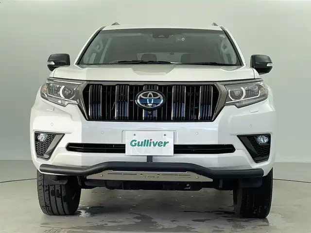 トヨタ ランドクルーザー プラド TX-L 70thアニバーサリーLTD 福井県 2022(令4)年 1.9万km ホワイトパールクリスタルシャイン 純正メーカーオプション９インチナビ/７人乗り仕様/寒冷地仕様　/全方位モニター　/プラドスーパーライブサウンド　　/サドルタン快適温熱レザーシート/純正１８インチアルミホイール　/純正スターター　/純正ビルトインＥＴＣ２．０/純正LEDヘッドライト/純正LEDフロントフォグ/フロントシールドデアイサー/ブラックルーフレール/JAOS製フロントスキッドバー/コンビハンドル/トヨタセーフティセンス/社外マフラー