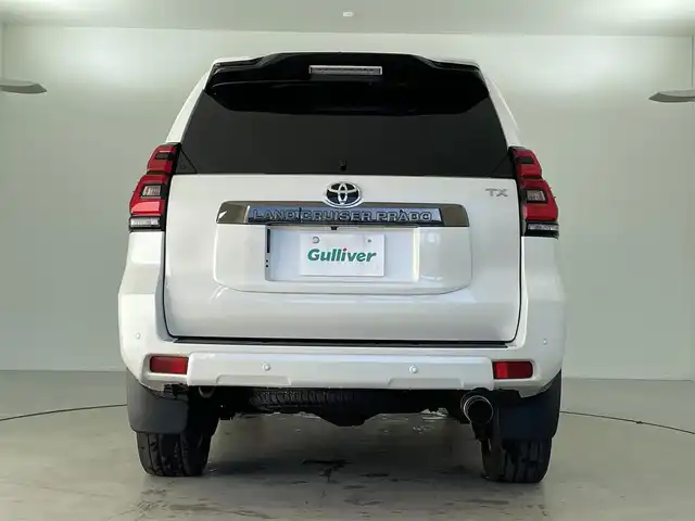 トヨタ ランドクルーザー プラド TX-L 70thアニバーサリーLTD 福井県 2022(令4)年 1.9万km ホワイトパールクリスタルシャイン 純正メーカーオプション９インチナビ/７人乗り仕様/寒冷地仕様　/全方位モニター　/プラドスーパーライブサウンド　　/サドルタン快適温熱レザーシート/純正１８インチアルミホイール　/純正スターター　/純正ビルトインＥＴＣ２．０/純正LEDヘッドライト/純正LEDフロントフォグ/フロントシールドデアイサー/ブラックルーフレール/JAOS製フロントスキッドバー/コンビハンドル/トヨタセーフティセンス/社外マフラー