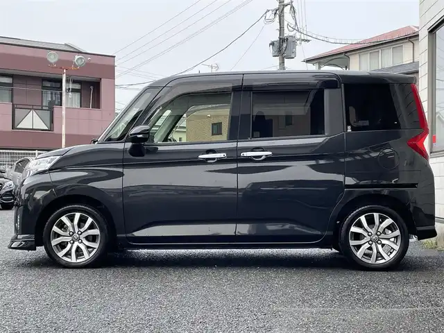 トヨタ ルーミー カスタムG－T 福岡県 2019(平31)年 2.7万km ブラックマイカメタリック ワンオーナー/純正9インチメモリナビ【NSZT-Y68T】/　(AM/FM/CD/DVD/Bluetooth/フルセグTV)/純正12.1インチフリップダウンモニター/全方位モニター/フロント・バックモニター/両側パワースライドドア/スマートアシストIII/・衝突警報機能/・衝突回避支援ブレーキ/・誤発進抑制制御機能/・車線逸脱警報/・先行車発進お知らせ機能/・オートハイビーム/横滑り防止機能/純正前方ドライブレコーダー【DRT-H68A】/クルーズコントロール/ビルトインETC/純正15インチアルミホイール/前席シートヒーター/後席ロールサンシェード/後席シートバックテーブル/純正フロアマット/スペアキー×1/保証書/取扱説明書/ナビ取扱説明書