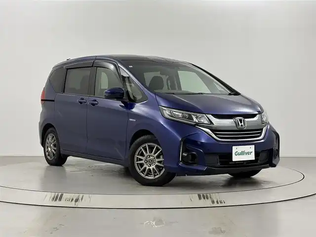 ホンダ フリード ハイブリット G ホンダセンシング 埼玉県 2019(平31)年 6.2万km コバルトブルーパール 衝突軽減ブレーキ/純正９インチナビゲーション/(フルセグTV/CD/DVD/Bluetooth/SD/AM/FM)/バックカメラ/アダプティブクルーズコントロール/レーンキープアシスト/先行車発進お知らせ/アクティブコーナリングライト/両側パワースライドドア /ビルトインETC/オートLEDヘッドライト/純正ホイールサマータイヤ車載/ロールサンシェード/スマートキー/プッシュスタート
