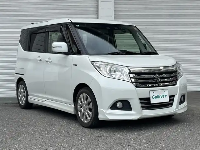 スズキ ソリオ HV MZ 高知県 2018(平30)年 5.3万km ピュアホワイトP 純正ナビ/　Bluetooth/フルセグ/　CD/DVD/AM/FM/全方位カメラ/ドライブレコーダー/ワンオーナー/クルーズコントロール/ETC/MTモード付AT/パドルシフト/プッシュスタート/スマートキー/両側パワースライドドア/HIDヘッドライト/純正15インチアルミホイール/純正フロアマット/シートヒーター/アイドリングストップ/オートライト/記録簿/保証書/取扱説明書/盗難防止装置