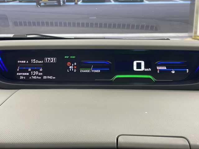 ホンダ フリード ハイブリット G 岐阜県 2023(令5)年 5.2万km フィヨルドミストパール 純正９インチナビ　/フルセグＴＶ　/純正１０インチフリップダウンモニター　/バックカメラ　/両側パワースライドドア　/ビルトインＥＴＣ　/Ｂｌｕｅｔｏｏｔｈ　/電格ミラー　/スマートキー　/シートヒーター/純正フロアマット/純正アルミホイール/LEDヘッドライト/コーナーセンサー/エンジンスタートボタン