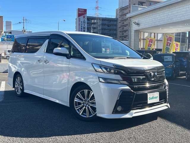 トヨタ ヴェルファイア Z Aエディション ゴールデンアイズ 大分県 2017(平29)年 8.9万km ホワイトパールクリスタルシャイン 〇ワンオーナー/〇純正メモリーナビ（NSZN-Z66T）/　CD/DVD/BT/フルセグ/ラジオ/〇バックカメラ/〇純正フリップダウンモニター/〇社外ドラブレコーダー/〇クルーズコントロール/〇両側パワースライドドア/〇ウッドコンビハンドル/〇ステアリングスイッチ/〇ETC/〇スマートキー/〇エンジンプッシュスタート/〇黒木目調パネル/〇フロアマット/〇ドアバイザー/〇nanoeエアコン/〇AC100V電源/〇パワーバックドア/〇保証書/〇取扱説明書/〇スペアキー