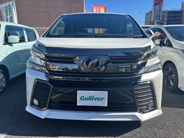 トヨタ ヴェルファイア Z Aエディション ゴールデンアイズ 大分県 2017(平29)年 8.9万km ホワイトパールクリスタルシャイン 〇ワンオーナー/〇純正メモリーナビ（NSZN-Z66T）/　CD/DVD/BT/フルセグ/ラジオ/〇バックカメラ/〇純正フリップダウンモニター/〇社外ドラブレコーダー/〇クルーズコントロール/〇両側パワースライドドア/〇ウッドコンビハンドル/〇ステアリングスイッチ/〇ETC/〇スマートキー/〇エンジンプッシュスタート/〇黒木目調パネル/〇フロアマット/〇ドアバイザー/〇nanoeエアコン/〇AC100V電源/〇パワーバックドア/〇保証書/〇取扱説明書/〇スペアキー