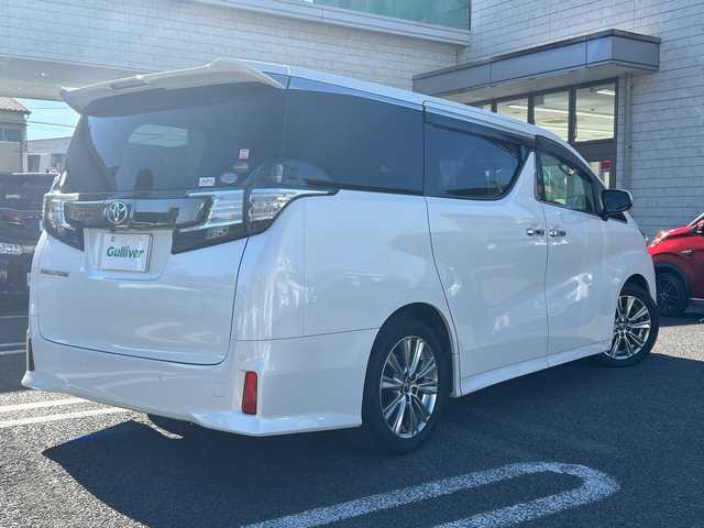 トヨタ ヴェルファイア Z Aエディション ゴールデンアイズ 大分県 2017(平29)年 8.9万km ホワイトパールクリスタルシャイン 〇ワンオーナー/〇純正メモリーナビ（NSZN-Z66T）/　CD/DVD/BT/フルセグ/ラジオ/〇バックカメラ/〇純正フリップダウンモニター/〇社外ドラブレコーダー/〇クルーズコントロール/〇両側パワースライドドア/〇ウッドコンビハンドル/〇ステアリングスイッチ/〇ETC/〇スマートキー/〇エンジンプッシュスタート/〇黒木目調パネル/〇フロアマット/〇ドアバイザー/〇nanoeエアコン/〇AC100V電源/〇パワーバックドア/〇保証書/〇取扱説明書/〇スペアキー