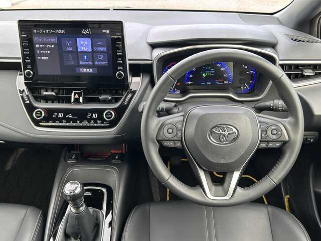 トヨタ カローラ スポーツ G スタイルパッケージ 千葉県 2021(令3)年 1.1万km グレーメタリック 6速MT/純正ディスプレイオーディオ/バックカメラ/Bluetooth/USB接続/Miracast/ビルトインETC/LEDヘッドライト/オートマチックハイビーム/フロントフォグランプ/電動格納ウィンカーミラー/前席シートヒーター/ステアリングヒーター/トヨタセーフティーセンス/プリクラッシュセーフティ/前後コーナーセンサー/レーンキープアシスト/ロードサインアシスト/レーダークルーズコントロール/電動パーキングブレーキ/ブレーキホールド/プッシュスタート/スマートキー（スペアキー1本）/純正フロアマット/純正16インチアルミホイール