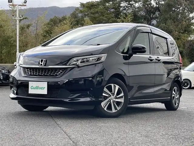 ホンダ フリード G ホンダセンシング 長崎県 2020(令2)年 4.2万km クリスタルブラックパール ワンオーナー/プッシュスタート/純正SDナビ/・AM/FM/CD/DVD/BT/TV/バックカメラ/純正フリップダウンモニター/両側パワースライドドア/ステアリングスイッチ/ハーフレザーシート/前席シートヒーター/アイドリングストップ/レーダークルーズコントロール/レーンキープアシスト/横滑り防止機能/前ドライブレコーダー/取扱説明書/ナビ取扱説明書/記録簿/スペアキー