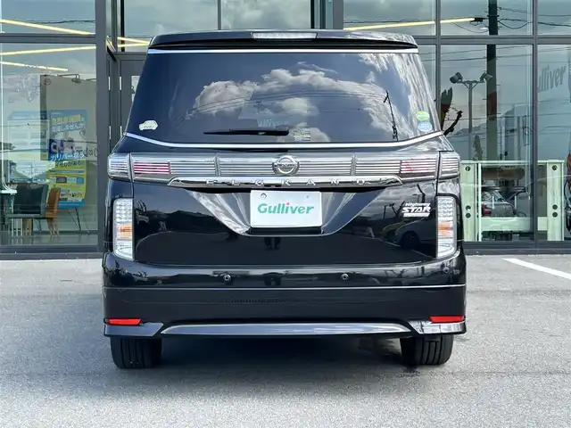 日産 エルグランド 350HWS ジェットブラック アーバンクロム 愛媛県 2018(平30)年 5.6万km ファントムブラック 純正8型ナビ/全周囲カメラ/両側電動スライドドア/フリップダウンモニター/ドライブレコーダー/アダプティブクルーズコントロール/クリアランスソナー/電動リアゲート/茶革温電動シート/シートメモリー機能/エンジンスターター/100V/100Wコンセント/リバース連動ミラー/電格ミラー/ステアリングリモコン/車線逸脱防止装置/衝突被害軽減装置/現状サマー(純正AＷ)(225/55/R18)/YOKOHAMA ADVANdB V552/禁煙車