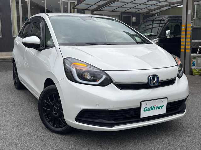 ホンダ フィット e:HEVホーム 京都府 2023(令5)年 1.6万km プラチナホワイトパール  ワンオーナー/ 登録時走行距離　15514キロ/ ホンダセンシング/ ホンダコネクト装着パッケージ/ インターナビ　フルセグTV/ マルチビューカメラ/ 合皮コンビシート/ Hスマートキー　エンジンプッシュスタート/ スマートキースペア　あり/ 前後ドライブレコーダー/ LEDヘッドライト/ USBポート/ ETC2.0/ ウィンカーミラー/ 保証書　取説　あり