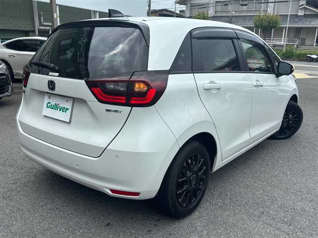 ホンダ フィット e:HEVホーム 京都府 2023(令5)年 1.6万km プラチナホワイトパール  ワンオーナー/ 登録時走行距離　15514キロ/ ホンダセンシング/ ホンダコネクト装着パッケージ/ インターナビ　フルセグTV/ マルチビューカメラ/ 合皮コンビシート/ Hスマートキー　エンジンプッシュスタート/ スマートキースペア　あり/ 前後ドライブレコーダー/ LEDヘッドライト/ USBポート/ ETC2.0/ ウィンカーミラー/ 保証書　取説　あり