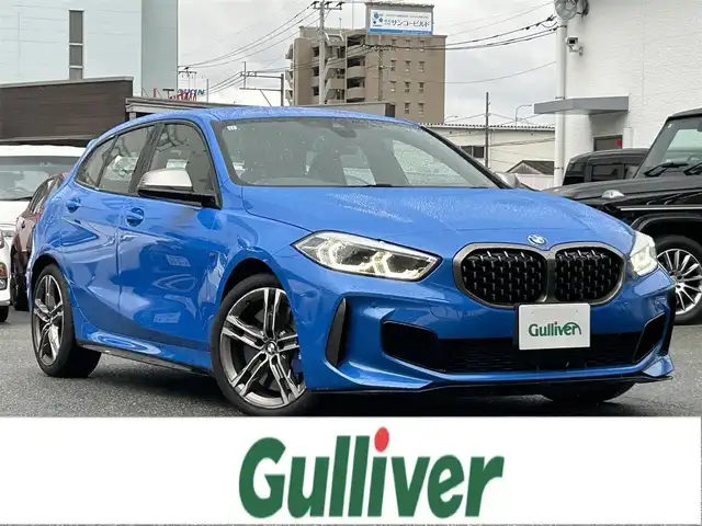 ＢＭＷ Ｍ１３５ｉ xDrive 福岡県 2019(令1)年 2.5万km ミサノブルー 禁煙車/純正ナビ/Bluetooth/クルーズコントロール追従有/前後ドライブレコーダー/前席パワーシート/コーナーセンサー（前後）/プッシュスタート/純正アルミホイール/純正フロアマット/パワーバックドア/パドルシフト/ビルトインETC/LEDヘッドライト/パワーステアリング/パワーウィンドウ/保証書/取扱説明書