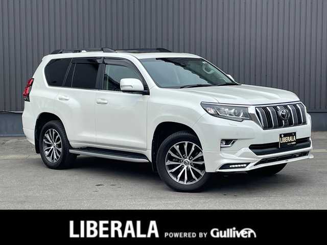 トヨタ ランドクルーザー プラド TZ－G 青森県 2020(令2)年 4.9万km ホワイトパールクリスタルシャイン /4WD/ディーゼル・ターボ/サンルーフ/黒革シート/　(D席メモリー付前席パワーシート//　前席シートヒーター/ベンチレーター)/3列目電動格納シート/OP寒冷地仕様車(Wバッテリー//　Fワイパーデアイサー/Rフォグ)/OP純正8型SDナビ/　(ブルーレイ/DVD/フルセグTV/USB/AUX/Bt)/スーパーライブサウンドシステム/全方位カメラ/純正エアサス/TRD(前後エアロ/マフラー/スカッフプレート)/Toyota Safety Sense /・プリクラッシュセーフティ/・レーンディパーチャーアラート/・オートマチックハイビーム/・レーダークルーズコントロール/OP/BSM/OP/ルーフレール/OP/ドアミラー足元照明/OP/トヨタマーク/カーテシランプ/OP/EGスターター/純正ドアバイザー/社外フロアマット(純正積込)/LEDオートライト/オートリベライザー//　オートマチックハイビーム/LEDフォグランプ/ウットコンビステア/オーディオ/ステアスイッチ/電動チルトステア/オートワイパー/純正カメラ一体型ドラレコ/デジタルインナーミラー/前後バンパーソナー/ウインカーミラー /純正サイドステップ/保・取