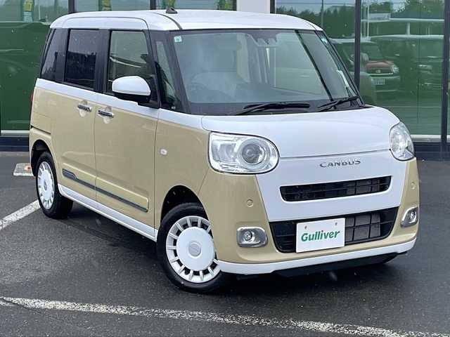 ダイハツ ムーヴ キャンバス ストライプス G 道東・釧路十勝 2024(令6)年 1万km シャイニングホワイトパール/サンドベージュメタリック ・４WD/・社外7インチメモリナビ/（BT・FM・AM・USB）/・バックカメラ/・ETC/・両側パワースライドドア/・スマートアシスト/・衝突警報/・衝突回避支援ブレーキ/・ペダル踏み間違い時加速抑制/・前席シートヒーター/・前席ほっとカップホルダー/・アイドリングストップ/・横滑り防止/・前後コーナーセンサー/・LEDヘッドライト/・LEDフォグランプ/・電動格納ミラー/・プッシュスタート/・スマートキー/・ダブルエアバッグ/・保証書